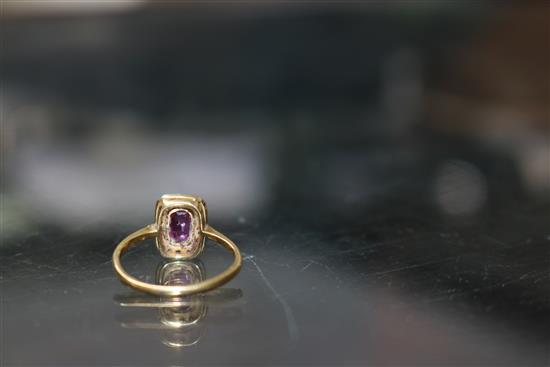 A 1920s/1930s 18ct gold and platinum ruby and diamond tablet ring, size M.